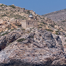 Lighthouse of entrance of port of Ios island, Cyclades, Greece