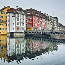 City of Luzern and reflection of old town in The Reuss River, Switzerland