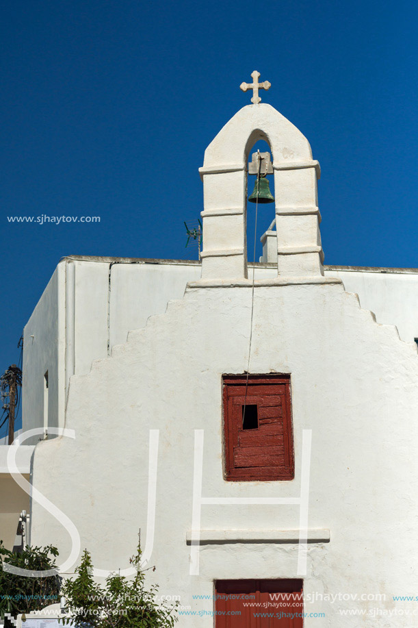 White orthodox church and small bell tower in Mykonos, Cyclades Islands, Greece