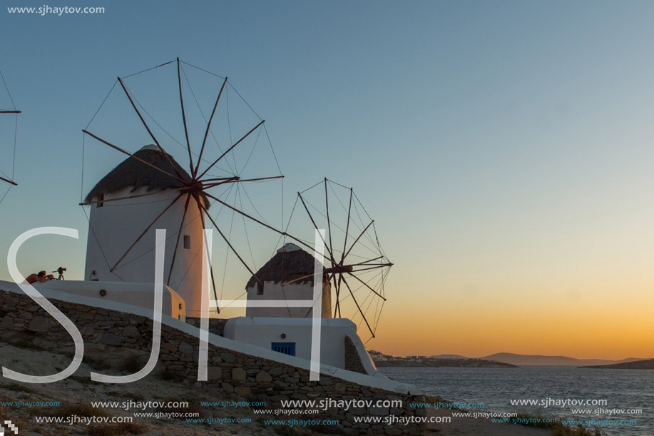 Amazing Sunset and White windmills on the island of Mykonos, Cyclades, Greece