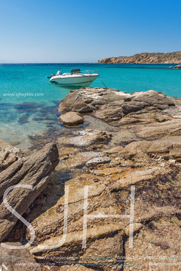 Small boat in Paranga Beach on the island of Mykonos, Cyclades, Greece