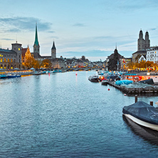 Sunset panorama of city of Zurich and reflection in Limmat River, Switzerland