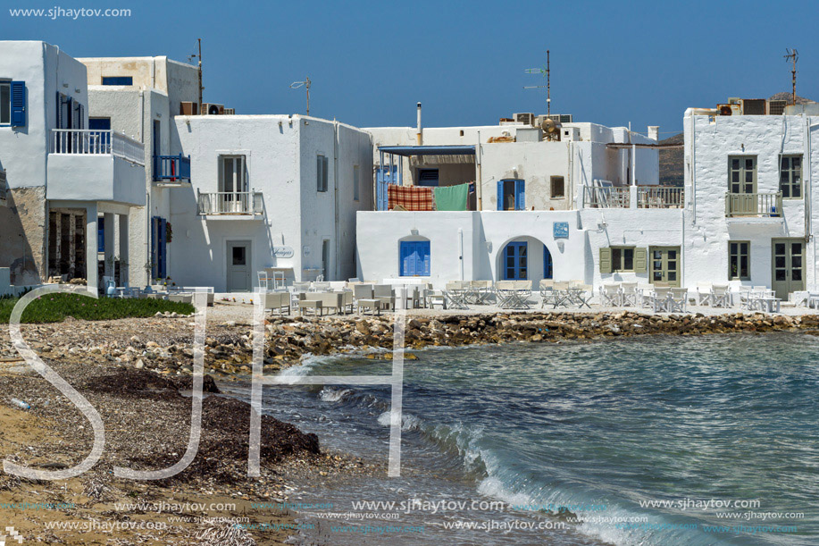 Old white house and Bay in Naoussa town, Paros island, Cyclades, Greece