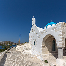 Amazing seascape with White chuch with blue roof in town of Parakia, Paros island, Cyclades, Greece