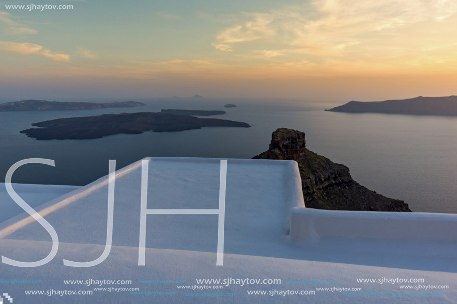 Amazing sunset view from town of Imerovigli to volcano, Santorini island, Thira, Cyclades, Greece