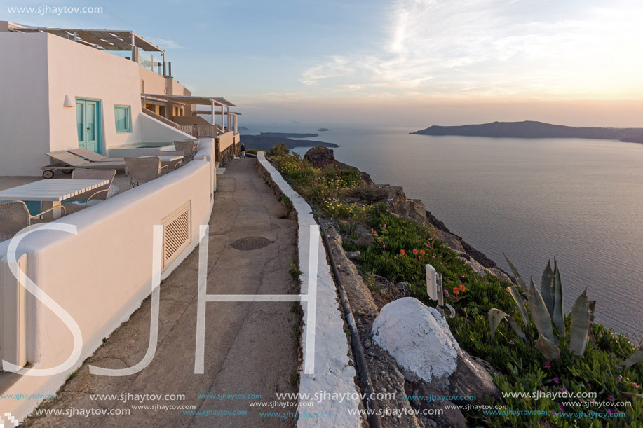 Amazing sunset in town of Imerovigli, Santorini island, Thira, Cyclades, Greece