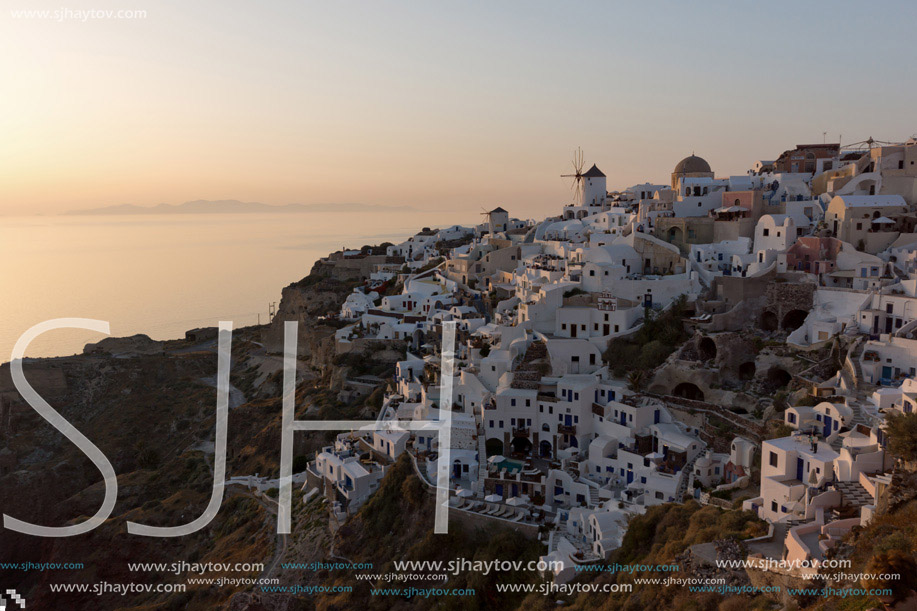 Last rays of sun in town of Oia, Santorini island, Thira, Cyclades, Greece