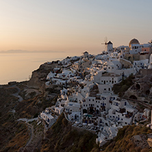 Last rays of sun in town of Oia, Santorini island, Thira, Cyclades, Greece