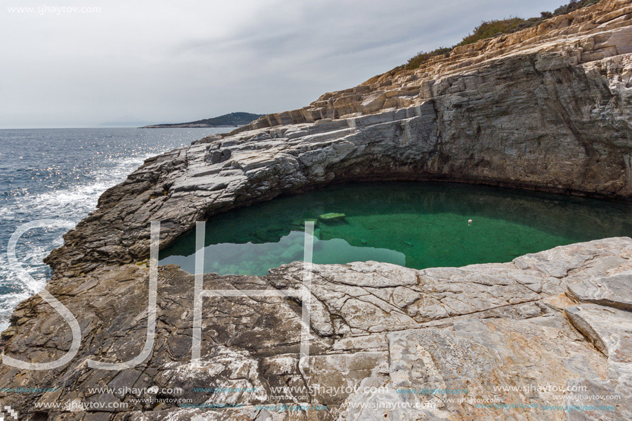 Green waters of Giola Natural Pool in Thassos island, East Macedonia and Thrace, Greece