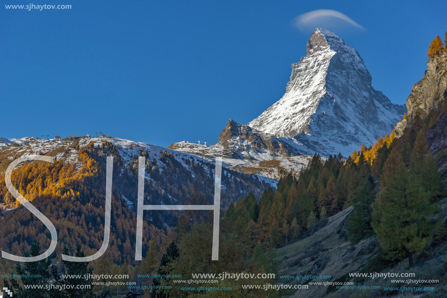First Rays of Sun over Matterhorn peak, view from Zermatt, Canton of Valais, Switzerland
