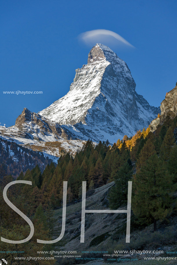 Small cloud over Matterhorn peak, view from Zermatt, Canton of Valais, Switzerland