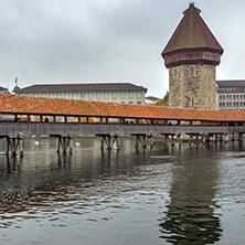 Foggy morning Chapel Bridge over Reuss River, Lucerne, Switzerland