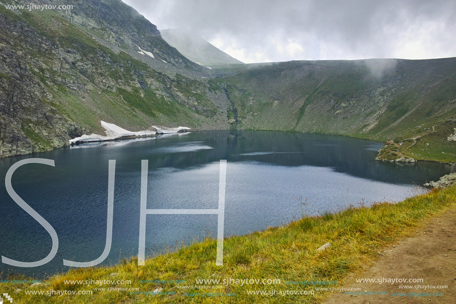 Amazing view of The Eye lake before storm, The Seven Rila Lakes, Bulgaria