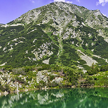 Landscape with Reflection of Hvoynati peak in Okoto lake, Pirin Mountain, Bulgaria