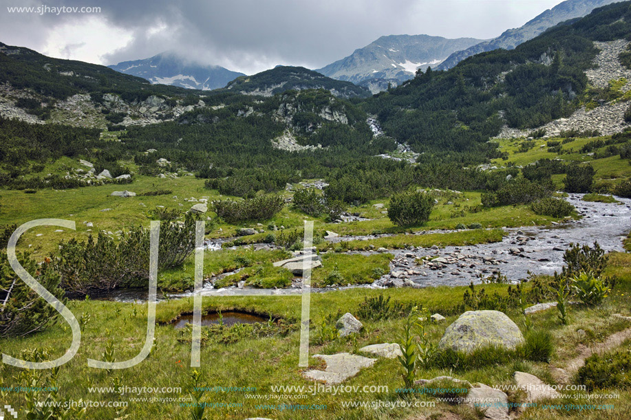 Clouds over Banderishki chukar peak and mountain river, Pirin Mountain, Bulgaria