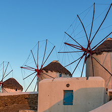 Sunset view of White windmills on the island of Mykonos, Cyclades, Greece