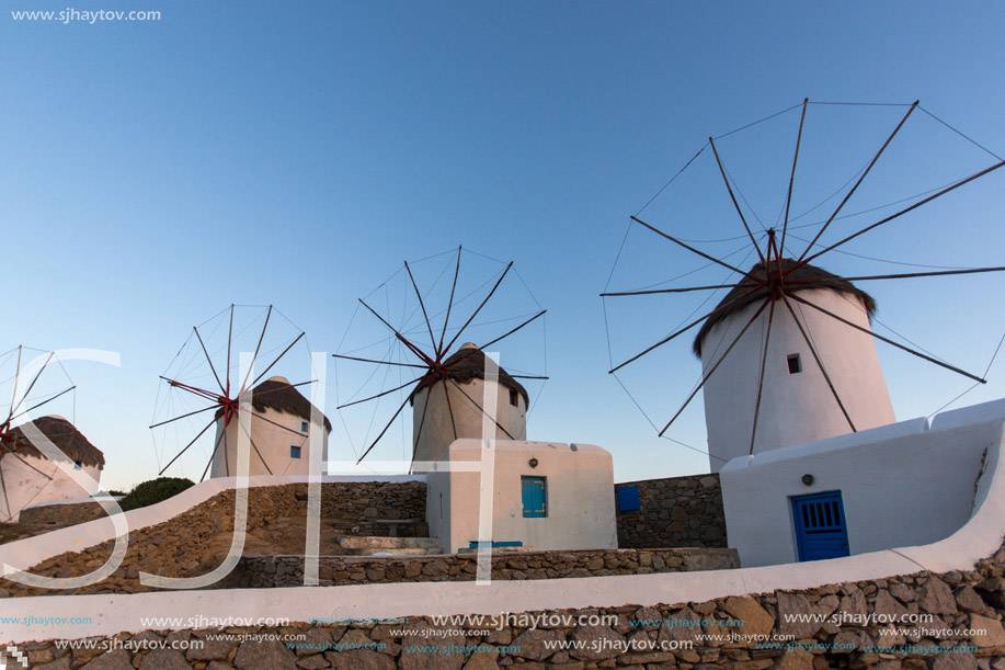Twilight view of White windmills on the island of Mykonos, Cyclades, Greece
