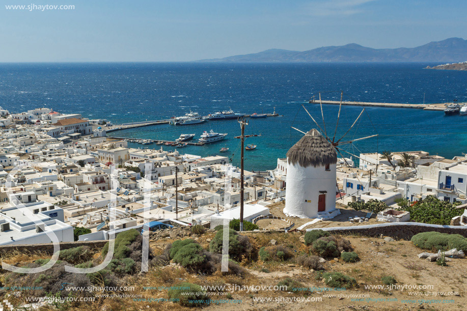 Landscape with white windmill and island of Mykonos, Cyclades, Greece