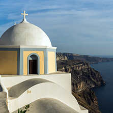 Orthodox church in town of Firostefani and panorama Santorini island, Thira, Cyclades, Greece