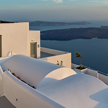 Amazing sunset view from town of Imerovigli to volcano, Santorini island, Thira, Cyclades, Greece