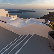 Amazing sunset view from town of Imerovigli to volcano, Santorini island, Thira, Cyclades, Greece