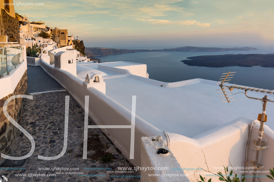 Panoramic view of Santorini island and Sunset over town of Imerovigli, Thira, Cyclades, Greece