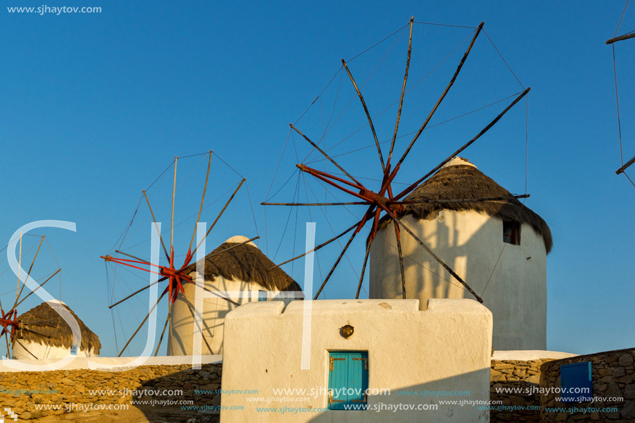 Sunset view of White windmills on the island of Mykonos, Cyclades, Greece