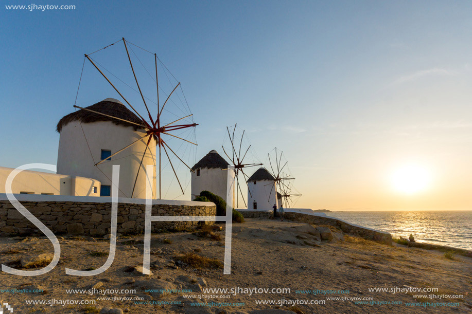 Sunset over White windmills on the island of Mykonos, Cyclades, Greece