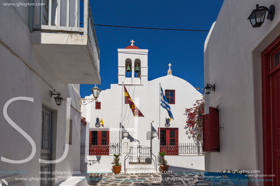 White orthodox church and small bell tower in Mykonos, Cyclades Islands, Greece