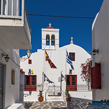 White orthodox church and small bell tower in Mykonos, Cyclades Islands, Greece