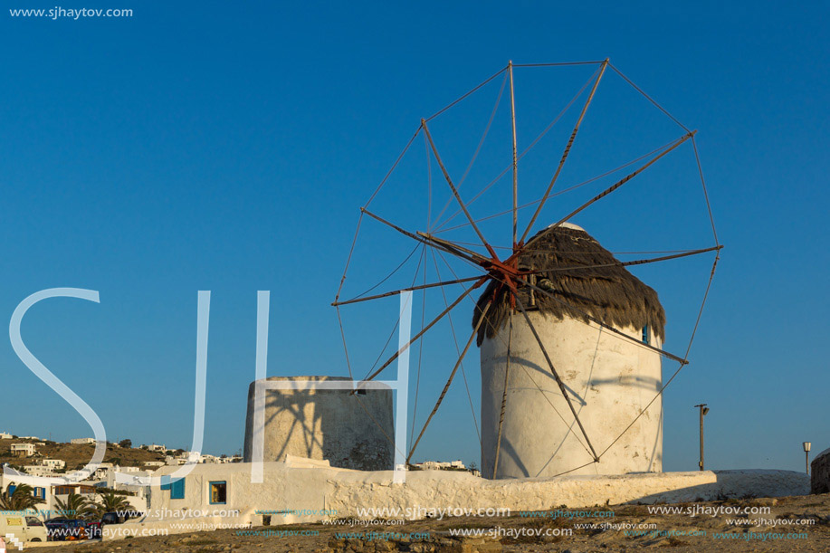 Amazing Sunset and White windmills on the island of Mykonos, Cyclades, Greece