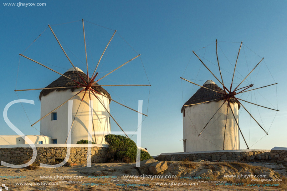 Sunset view of White windmills on the island of Mykonos, Cyclades, Greece