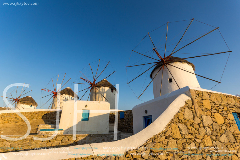 Sunset over White windmills on the island of Mykonos, Cyclades, Greece