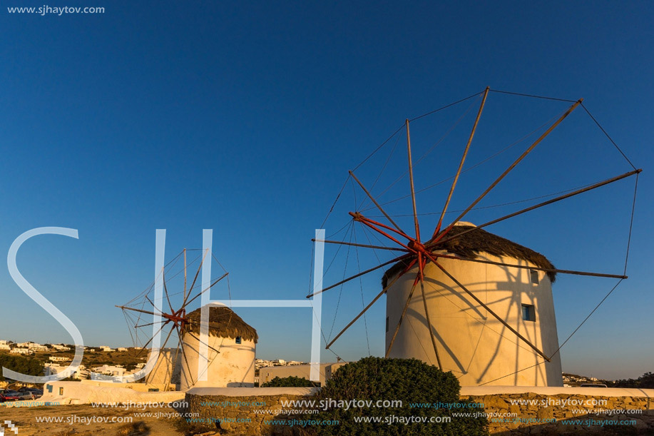 Sunset over White windmills on the island of Mykonos, Cyclades, Greece