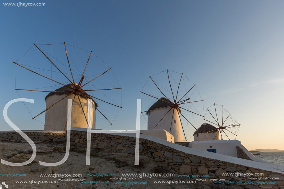 Amazing Sunset and White windmills on the island of Mykonos, Cyclades, Greece