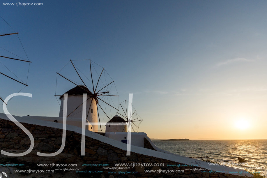 Sunset view of White windmills on the island of Mykonos, Cyclades, Greece