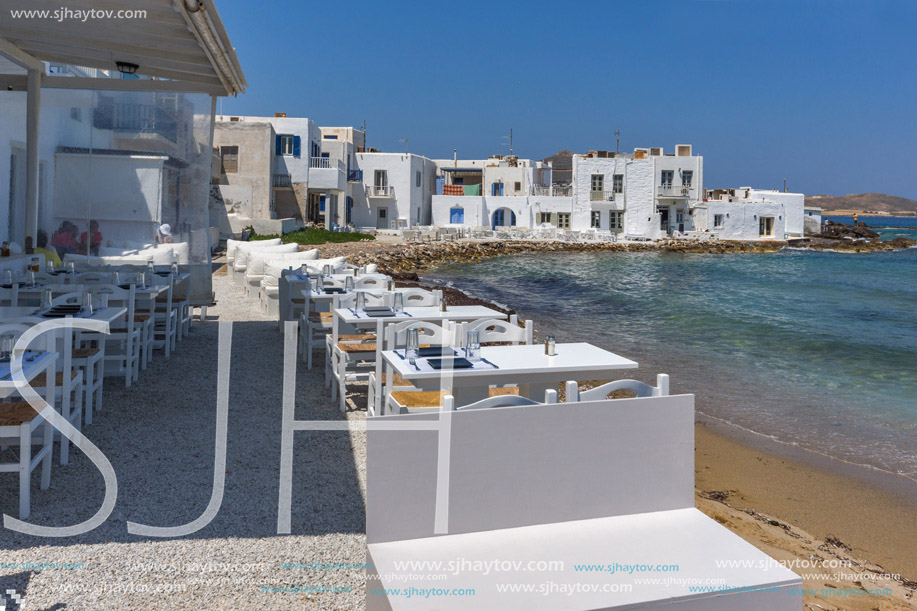 Old white house and Bay in Naoussa town, Paros island, Cyclades, Greece