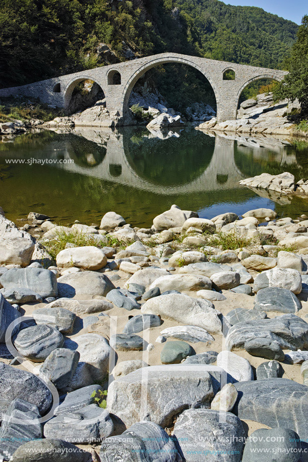 Reflection of The Devil"s Bridge in Arda river and Rhodopes mountain, Kardzhali Region, Bulgaria