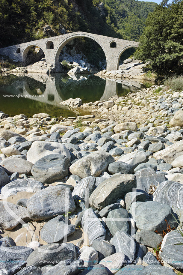 Reflection of The Devil"s Bridge and Rhodopes mountain in Arda river, Kardzhali Region, Bulgaria