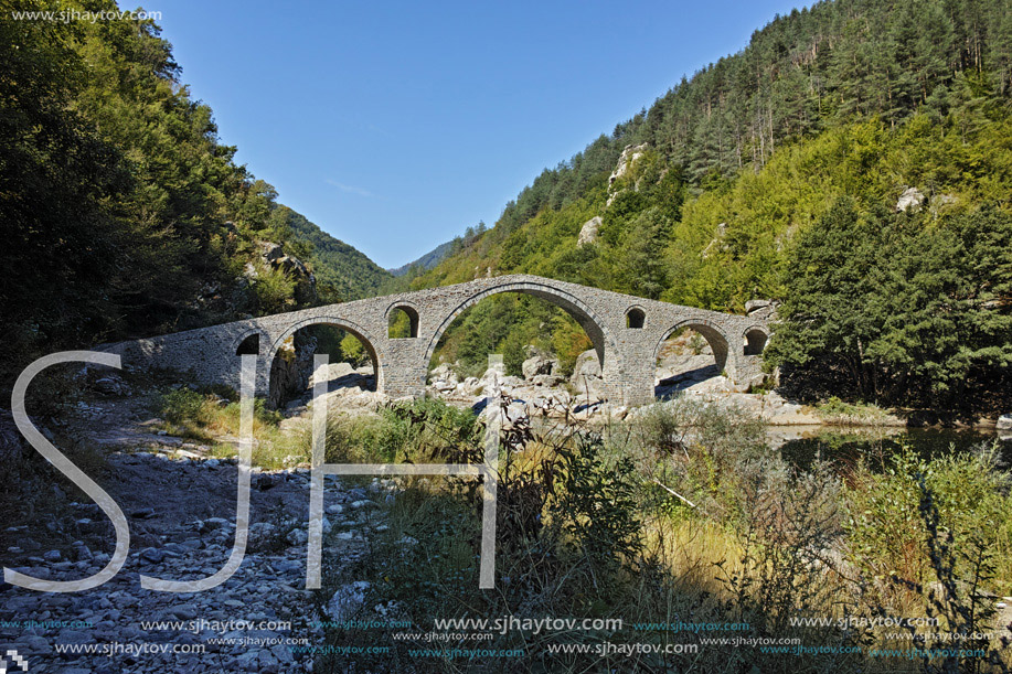 Reflection of The Devil"s Bridge in Arda river and Rhodopes mountain, Kardzhali Region, Bulgaria