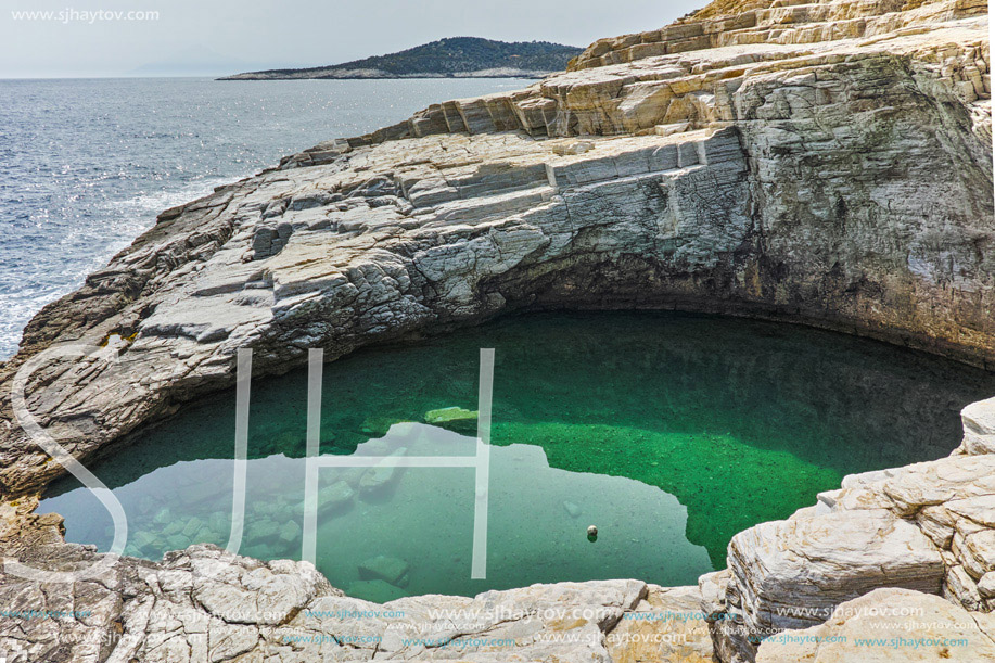 Green waters of Giola Natural Pool in Thassos island, East Macedonia and Thrace, Greece