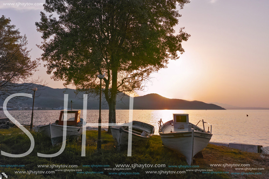 Old boats and Sunset on embankment of Thassos town, East Macedonia and Thrace, Greece