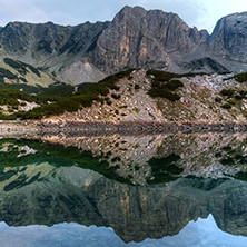 Reflection of rocks in Sinanitsa lake, Pirin Mountain, Bulgaria