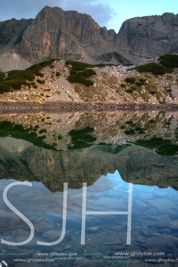 Reflection of rocks in Sinanitsa lake, Pirin Mountain, Bulgaria