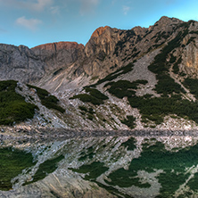 Reflection of rocky peaks in Sinanitsa lake, Pirin Mountain, Bulgaria