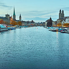 Sunset panorama of city of Zurich and reflection in Limmat River, Switzerland