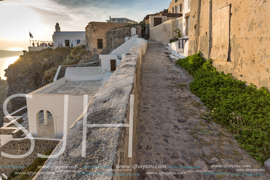 Sunset view of street in Fira, Santorini island, Thira, Cyclades, Greece