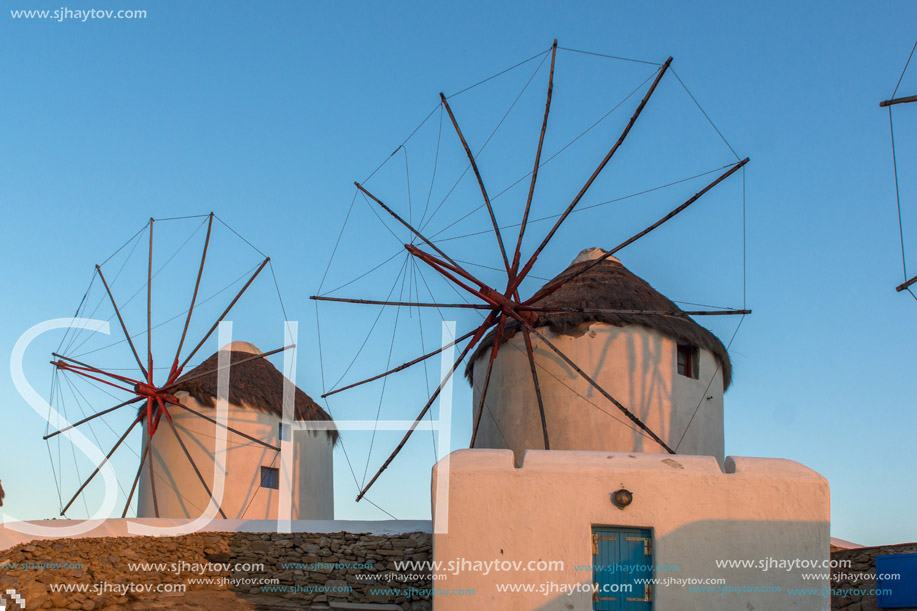 Amazing Sunset and White windmills on the island of Mykonos, Cyclades, Greece