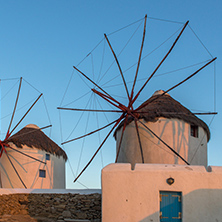 Amazing Sunset and White windmills on the island of Mykonos, Cyclades, Greece