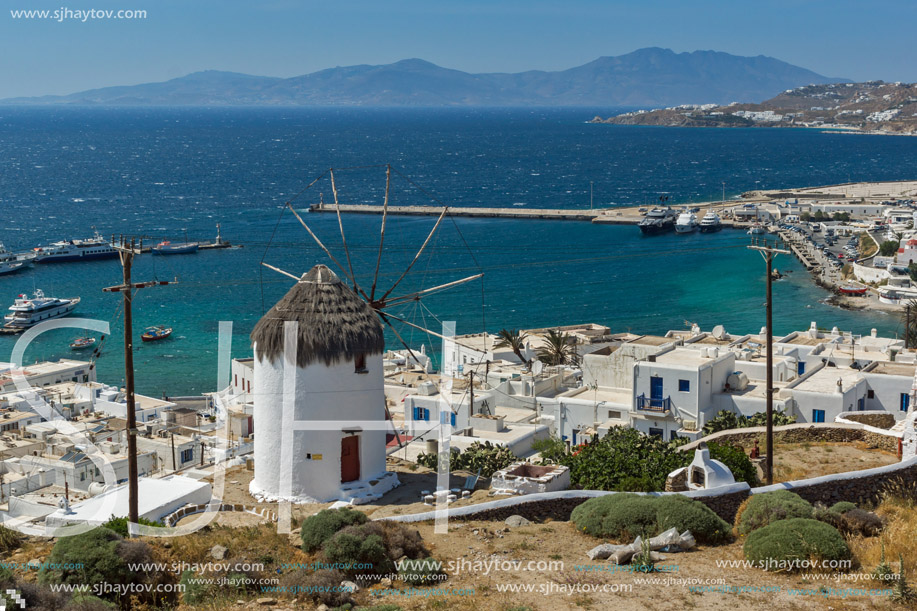Amazing Seascape of white windmill and island of Mykonos, Cyclades, Greece